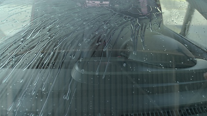 Image showing Eashing dirty car closeup footage