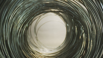 Image showing Camera motion in round steel wired tunnel