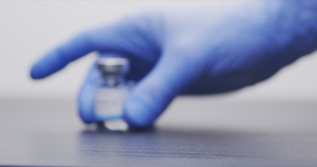 Image showing Vaccine in human hands closeup footage