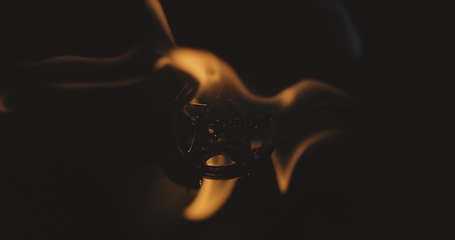 Image showing Amulet burning in the fire 120fps slow motion footage