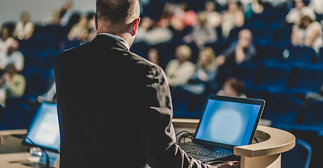 Image showing Public speaker giving talk at business event.