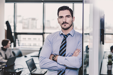 Image showing Team leader with coworkers working in office.