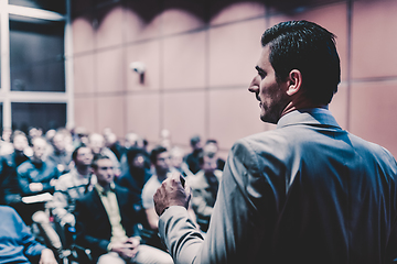 Image showing Public speaker giving talk at business event.