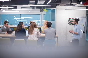 Image showing Multiethnic startup business team having meeting