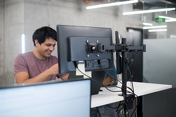 Image showing young multiethnics team of software developers working together