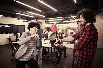 Image showing multiethnics business team boxing at office