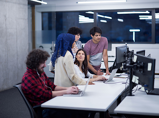 Image showing multiethnics team of software developers working together