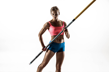 Image showing Female pole vaulter training on white studio background