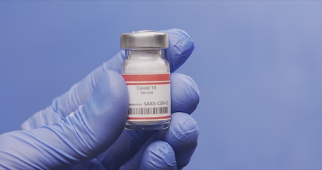 Image showing Vaccine in human hands closeup footage