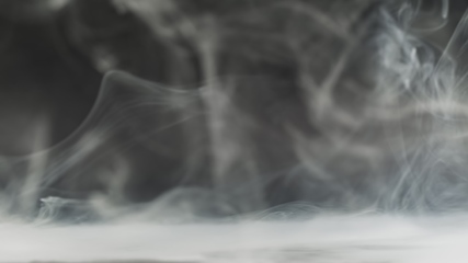 Image showing Smoke cloud whirling against dark background slow motion footage