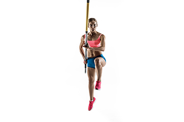 Image showing Female pole vaulter training on white studio background