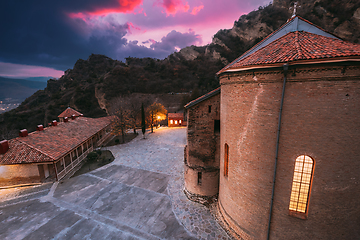 Image showing Mtskheta, Georgia. Shio-Mgvime Monastery. Central Part Of Medieval Monastic ShioMgvime Complex In Limestone Canyon In Autumn Sunset. Colorful Altered Sky Above Famous Place