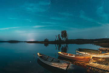 Image showing Real Starry Sky And Night Stars Above Lake. Natural Starry Sky Reflection Landscape .