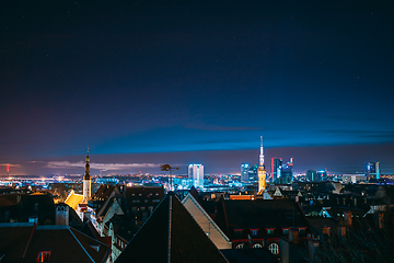 Image showing Tallinn, Estonia, Europe. Natural Night Starry Sky Above Tallinn Skyline Cityscape. Old Town And Modern City. Popular Place With Famous Landmarks. UNESCO. Tallinn, Estonia, Europe. Natural Night Star