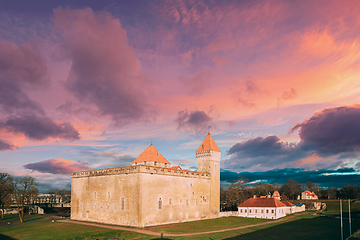 Image showing Kuressaare, Saaremaa Island, Estonia. Episcopal Castle In Sunset. Traditional Medieval Architecture, Famous Attraction Landmark. Altered Sky. Traditional Architecture And Famous Place