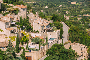 Image showing Gordes, Provence, France. Beautiful Scenic View Of Medieval Hilltop Village Of Gordes. Sunny Summer Sky. Famous Landmark.