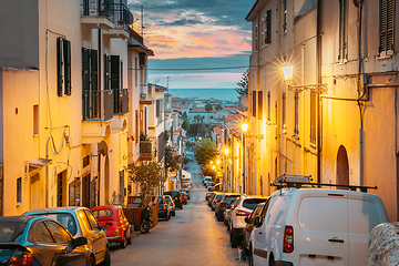 Image showing Terracina, Italy. Cars Parked On Narrowm Street In European City In Summer Night