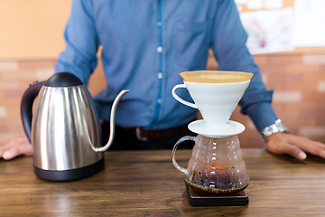 Image showing Male Barista making of coffee in cafe