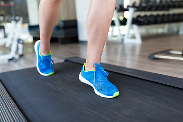 Image showing Woman running on treadmill in gym