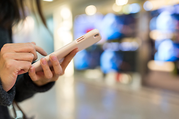 Image showing Woman sending text message on smart phone