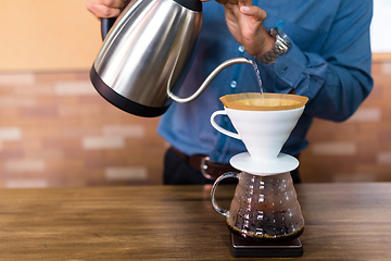 Image showing Water pouring on coffee filter