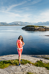 Image showing Young woman against view on norwegian fjords