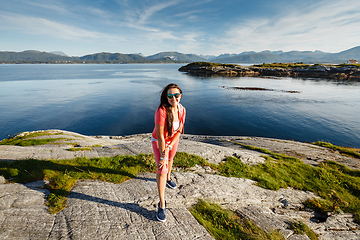 Image showing Young woman against view on norwegian fjords