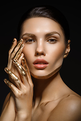 Image showing girl with golden paint on fingers