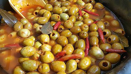 Image showing Marinated olives with hot pepper and bay leaf  
