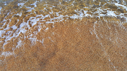 Image showing Clear sea water in the coastal sand