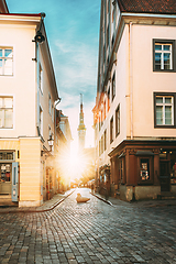 Image showing Tallinn, Estonia. Famous Old Traditional Town Hall In Sunny Evening. Sun Shining Through Old Town Narrow Streets. Famous Landmark And Popular Place. Destination Scenic. UNESCO World Heritage Site. Po