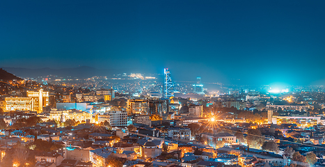 Image showing Tbilisi, Georgia. Elevated Rooftop View In Night Illuminations. Georgian Capital Skyline Cityscape. Panorama, Panoramic Evening View