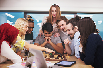 Image showing multiethnic group of business people playing chess