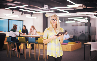 Image showing blonde businesswoman working online using digital tablet