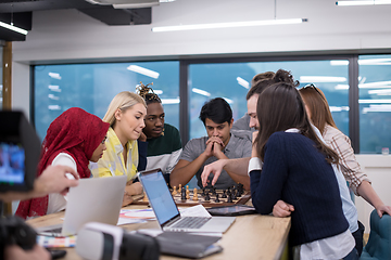 Image showing multiethnic group of business people playing chess