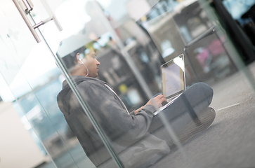 Image showing software developer working on the floor