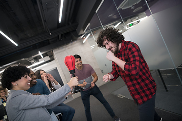 Image showing multiethnics business team boxing at office