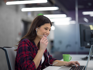 Image showing female software developer using laptop computer