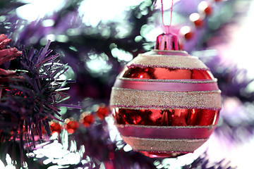 Image showing Christmas ornaments on tree.