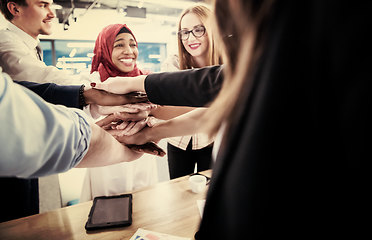 Image showing multiethnic Group of young business people celebrating success