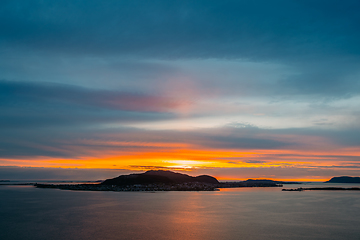 Image showing Alesund, Norway. Amazing Natural Bright Dramatic Sky Above Alesund Valderoya And Islands In Sunset Time. Colorful Sky Background. Beauty In Norwegian Nature