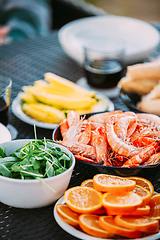 Image showing Traditional Snacks Of Mediterranean Cuisine. Shrimps And Oranges