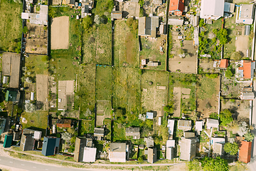 Image showing Belarus, Europe. Aerial View Of Small Town, Village Cityscape Skyline In Summer Day. Residential District, Houses And Vegetable Garden Beds In Bird\'s-eye View