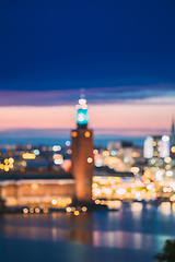 Image showing Stockholm, Sweden. Night Skyline Abstract Boke Bokeh Background. Design Backdrop. Tower Of Stockholm City Hall