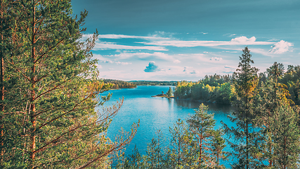 Image showing Swedish Nature. Sweden. Summer Lake Or River In Beautiful Summer Sunny Day. Forest Growing On Stone Coast