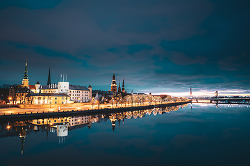 Image showing Riga, Latvia, Europe. Cityscape In Morning Time. Night View Of Castle, Dome Cathedral And St. Peter\'s Church. Popular Place With Famous Landmarks. UNESCO. Old Town In Street Christmas Decoration