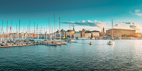 Image showing Stockholm, Sweden. Scenic Famous Panoramic View Of Embankment In Old Town Of Stockholm In Sunset Lights. Jetty With Many Moored Yachts. Popular Destination Scenic Place. Panorama