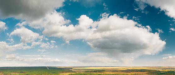 Image showing Aerial View Of Rain Clouds Above Coniferous Forest Pines Woods Landscape In Early Spring Day. Top View Of Beautiful European Nature From Attitude. Drone View. Bird\'s Eye View