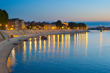 Image showing People walking embankment Arles, France