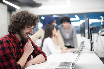 Image showing young multiethnics team of software developers working together